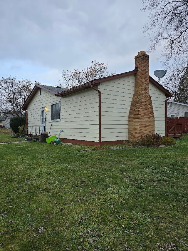 view of home's exterior featuring a lawn