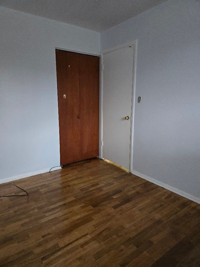 interior space with dark hardwood / wood-style flooring