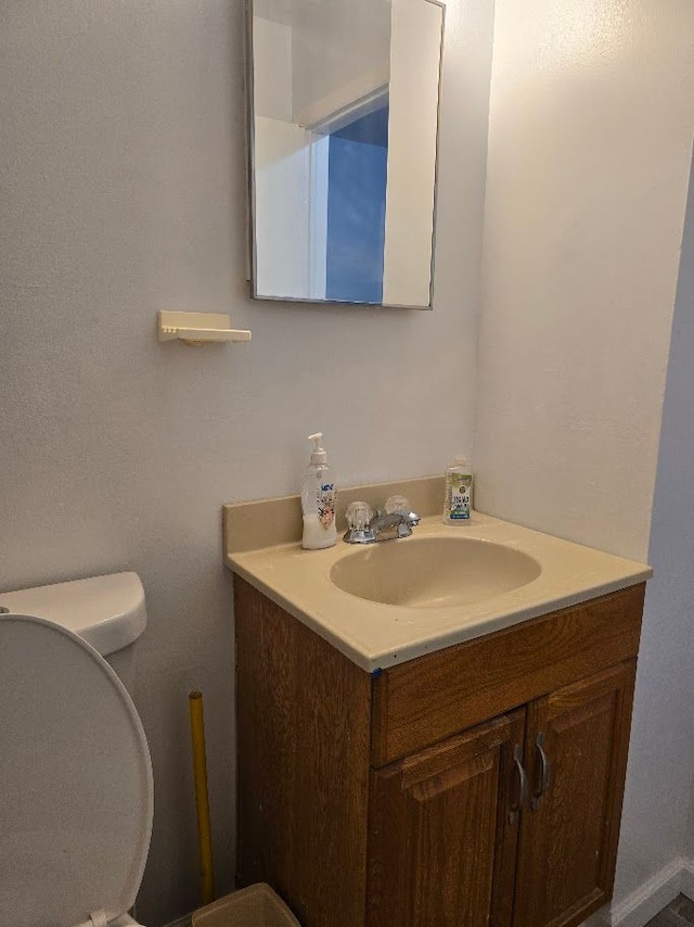 bathroom with vanity and toilet