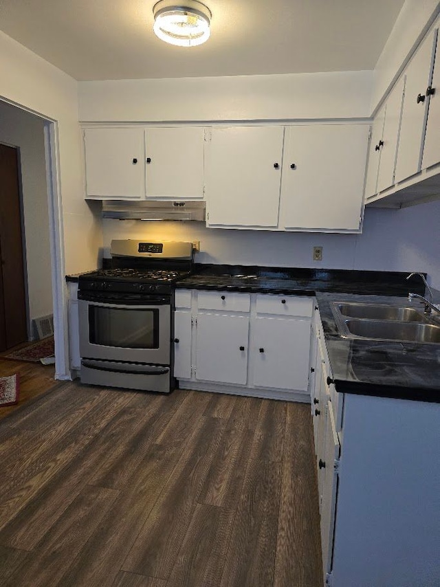 kitchen featuring white cabinetry, sink, dark wood-type flooring, and stainless steel gas range