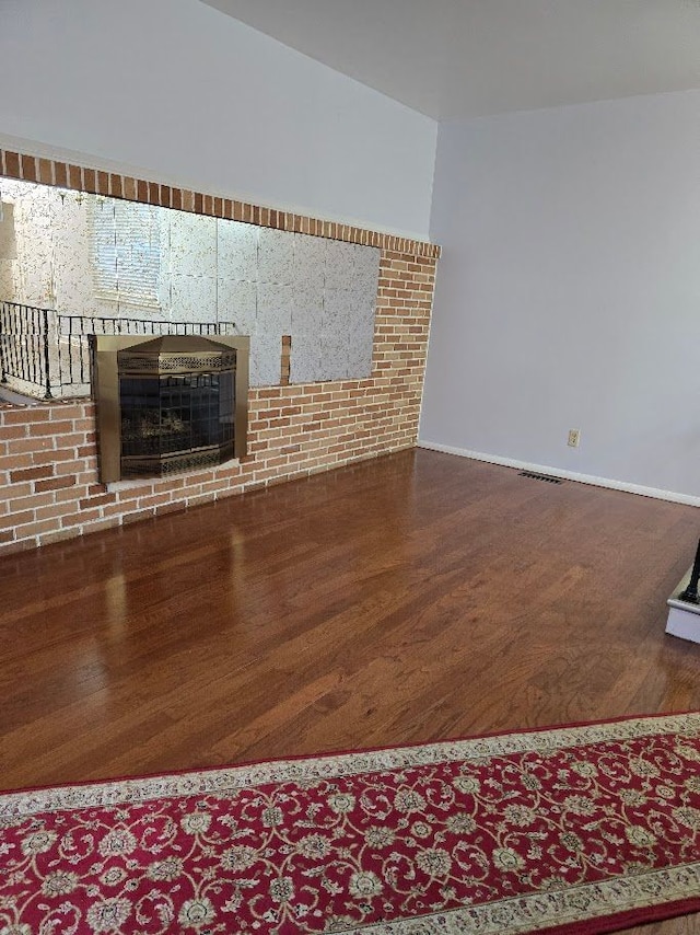 unfurnished living room featuring wood-type flooring