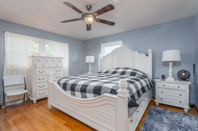 bedroom featuring ceiling fan and light hardwood / wood-style flooring