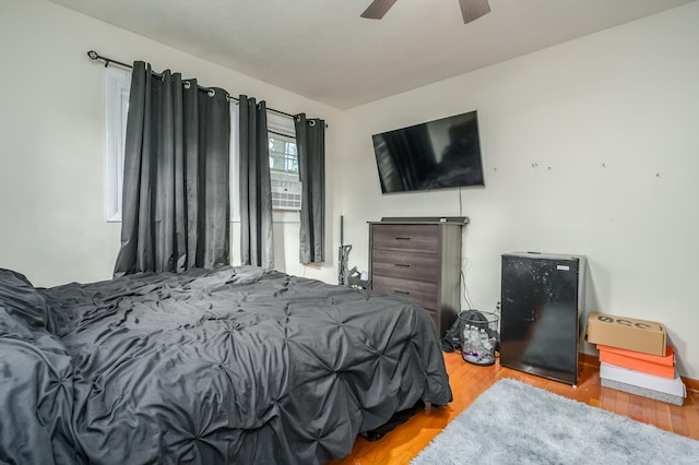 bedroom featuring light hardwood / wood-style flooring and ceiling fan