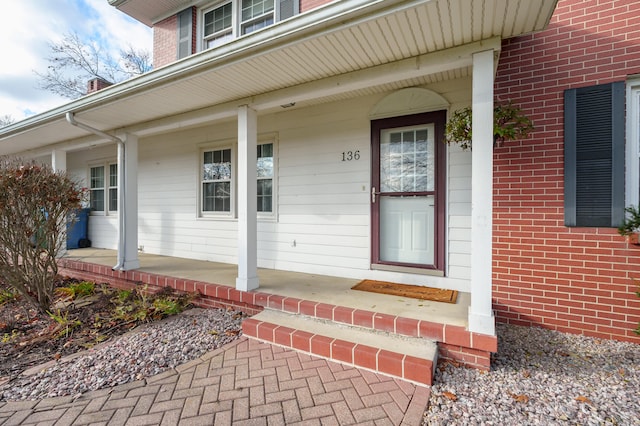 entrance to property featuring a porch