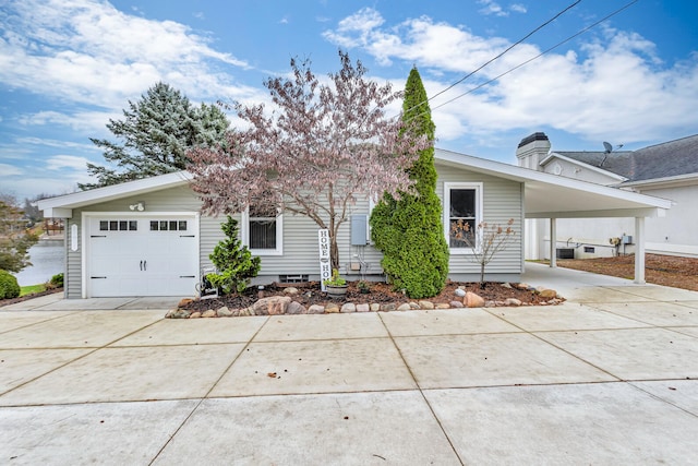 ranch-style house with a carport and a garage