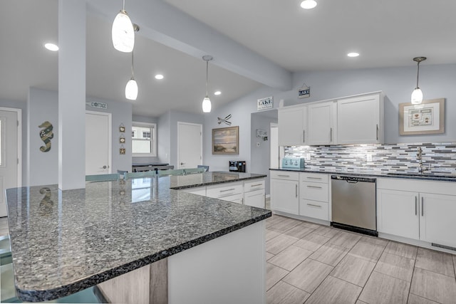 11767 Greenbriar Dr, Jerome, MI 49249 - kitchen with stainless steel dishwasher, a sink, tasteful backsplash, white cabinetry, and dark stone counters