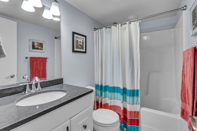 full bathroom featuring vanity, shower / tub combo, and toilet