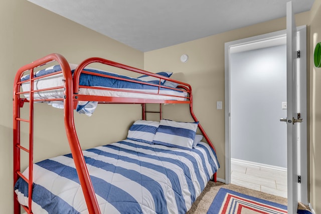 bedroom featuring light colored carpet