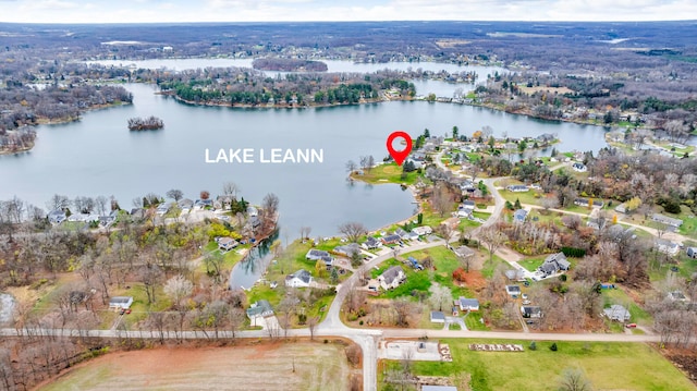 birds eye view of property with a water view