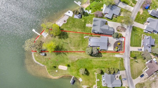 11767 Greenbriar Dr, Jerome, MI 49249 - aerial perspective of suburban area with a large body of water