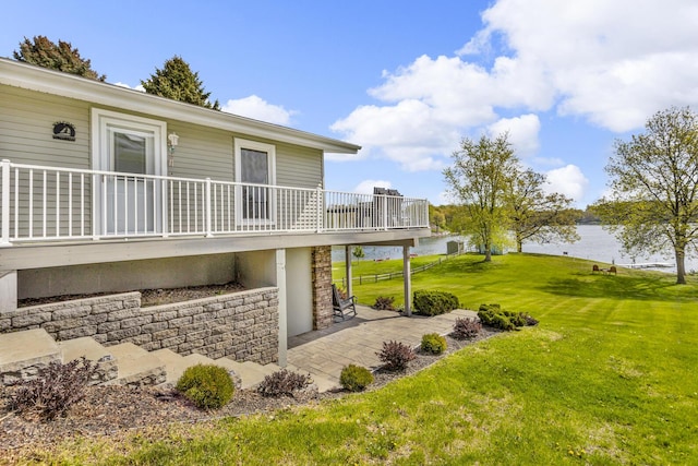 11767 Greenbriar Dr, Jerome, MI 49249 - view of green lawn featuring a water view and a patio area