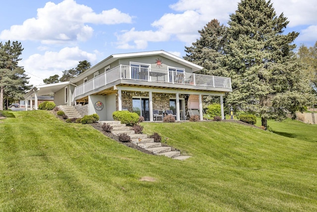 11767 Greenbriar Dr, Jerome, MI 49249 - view of front of house featuring a front yard, a wooden deck, stone siding, and stairway
