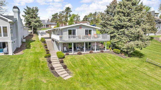 11767 Greenbriar Dr, Jerome, MI 49249 - rear view of property featuring a patio area, a deck, and a yard