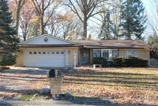 ranch-style home with a garage