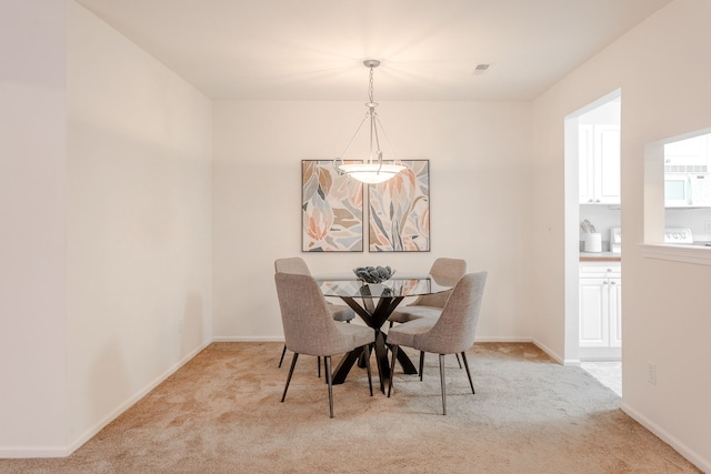 view of carpeted dining space