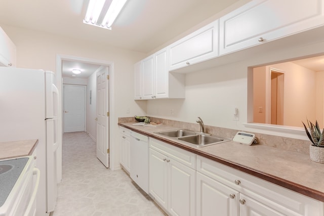 kitchen featuring white cabinetry, white appliances, and sink