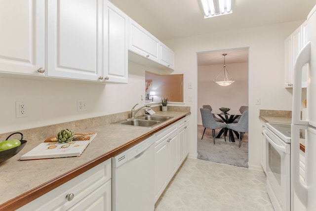 kitchen featuring white cabinets, pendant lighting, white appliances, and sink