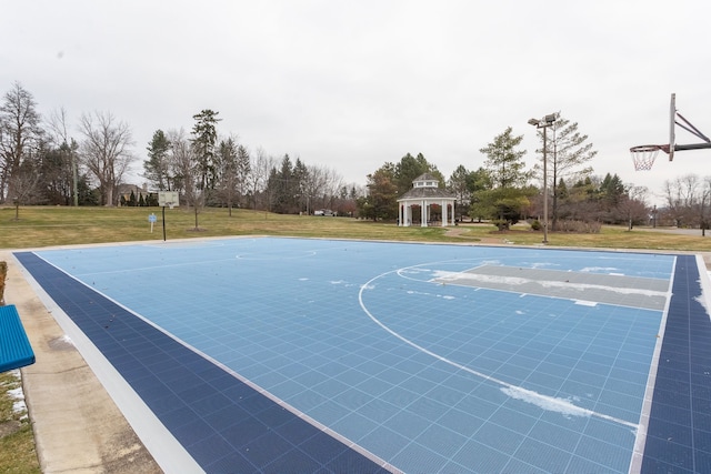 view of basketball court featuring a gazebo and a yard