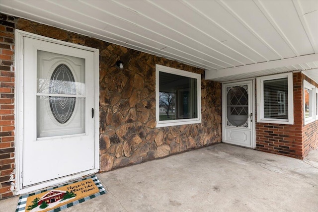 entrance to property with brick siding