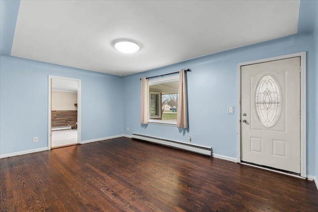 foyer entrance with a baseboard heating unit, wood finished floors, and baseboards