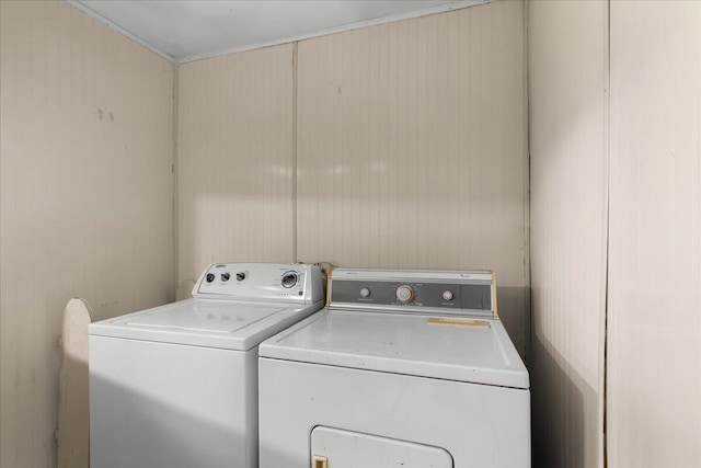 clothes washing area with washer and dryer and laundry area