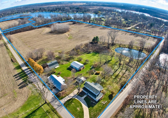 birds eye view of property with a rural view and a water view