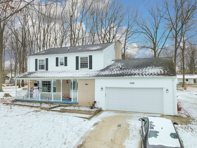 view of front of house featuring a porch and a garage