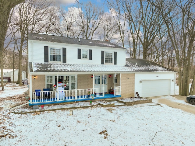 view of front of house featuring a garage and a porch