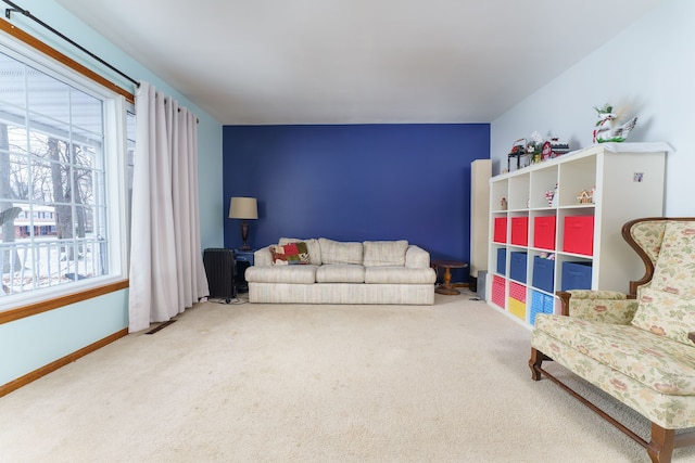 living room with a wealth of natural light and carpet