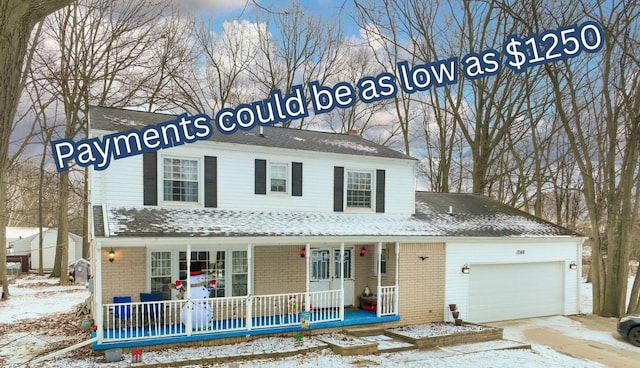 view of front of house with a garage and a porch