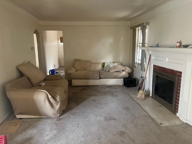 carpeted living room with a fireplace