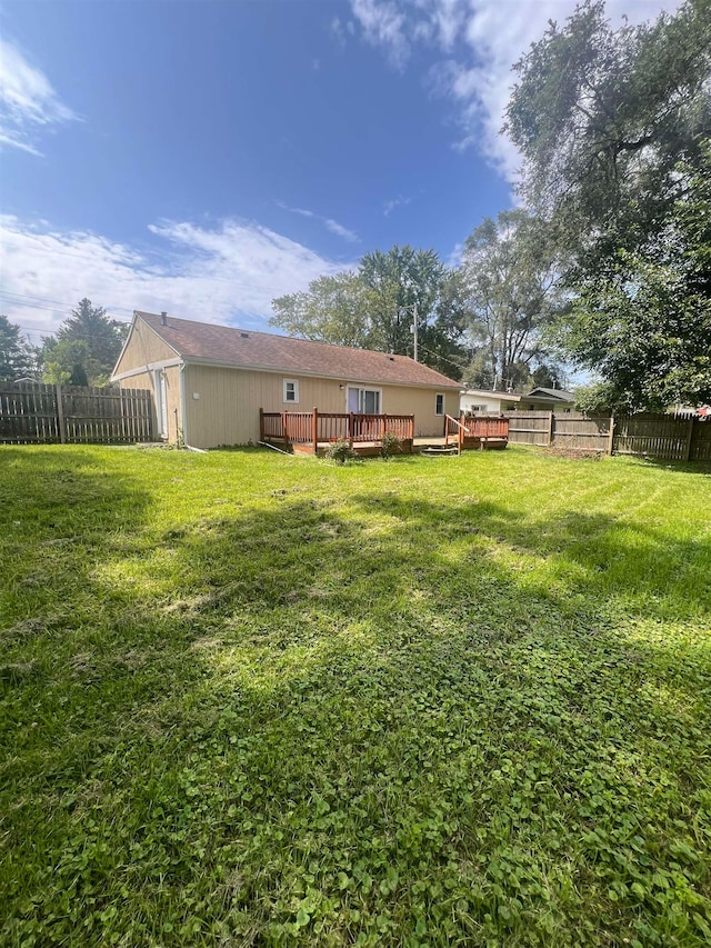 view of yard featuring a wooden deck