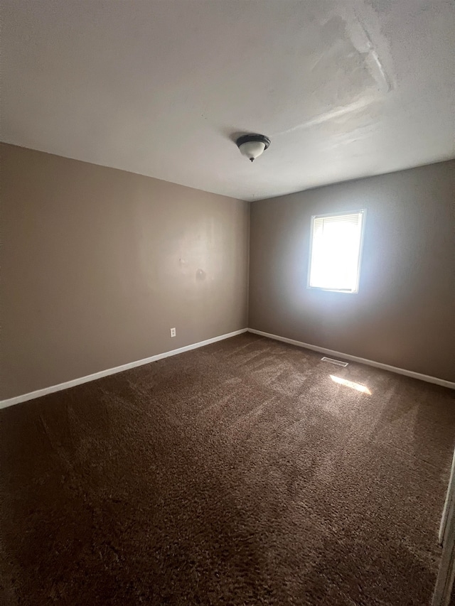 empty room with carpet flooring