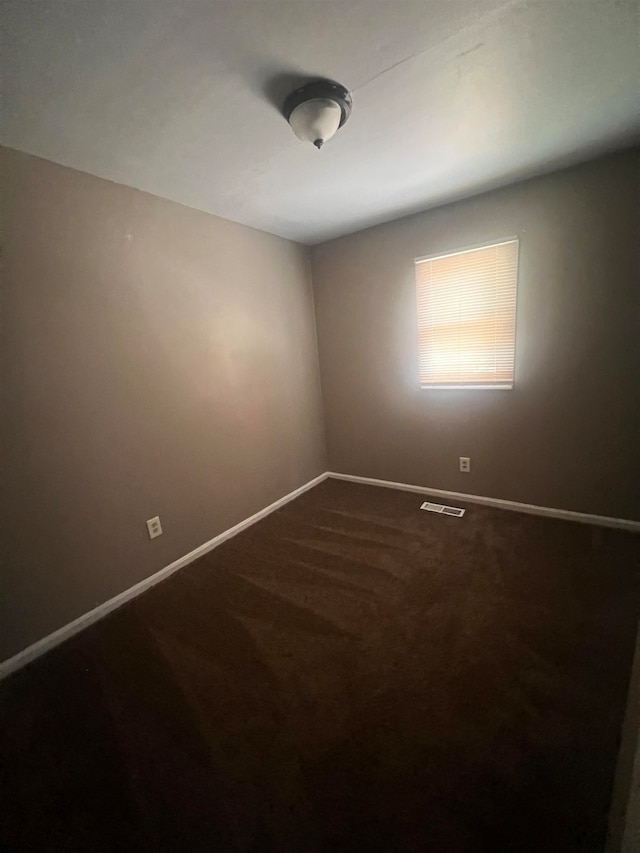 spare room with carpet floors