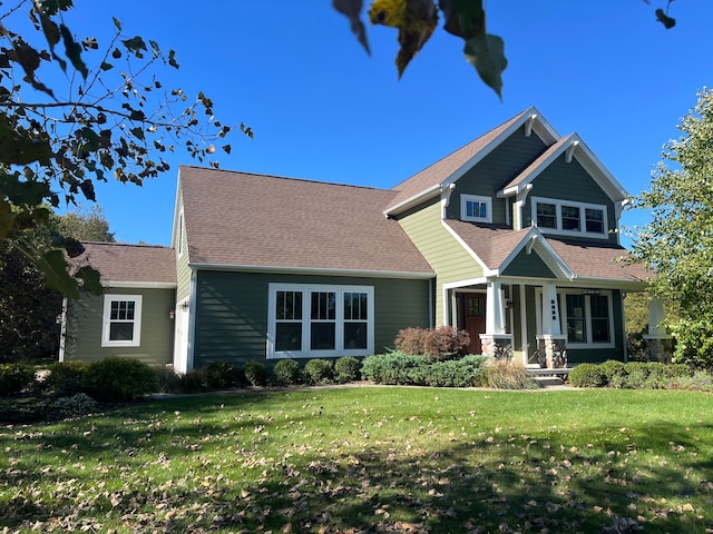 craftsman-style house with a front yard