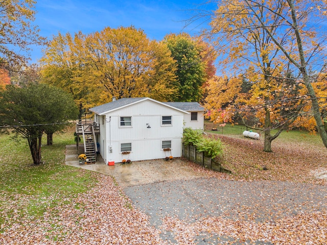 view of side of property with a wooden deck