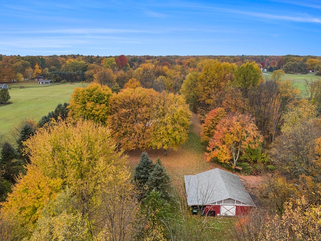 drone / aerial view with a rural view and a wooded view