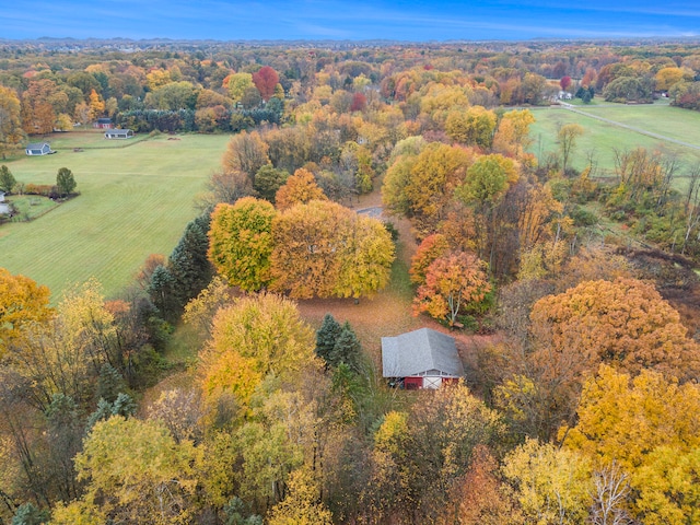 aerial view featuring a forest view and a rural view