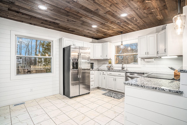 kitchen featuring pendant lighting, stainless steel appliances, visible vents, wood ceiling, and white cabinetry