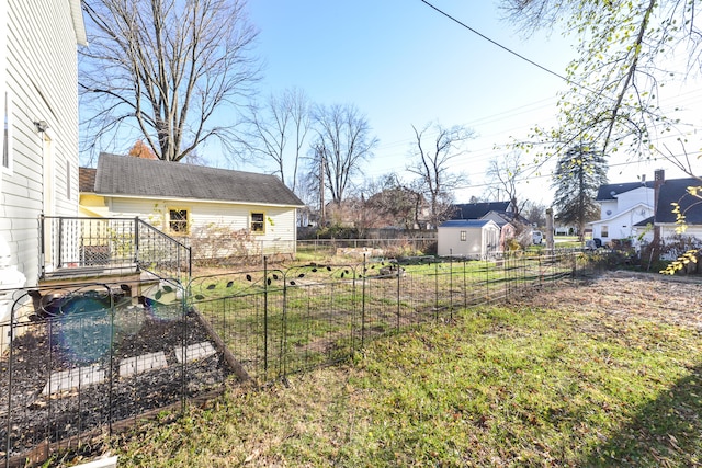 view of yard with a storage unit