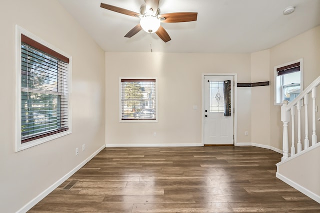 foyer featuring ceiling fan and dark hardwood / wood-style floors