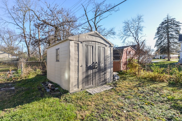 view of outdoor structure with a lawn