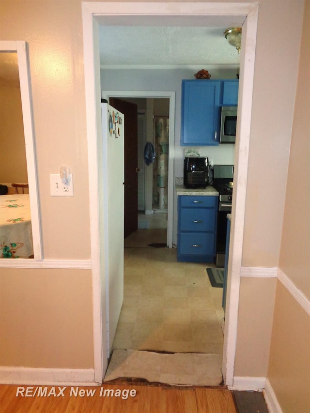 corridor with light hardwood / wood-style floors