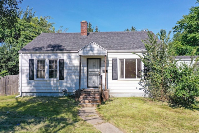 bungalow-style house with a front lawn