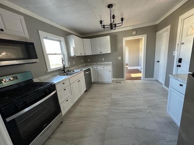 kitchen featuring decorative light fixtures, white cabinetry, an inviting chandelier, and appliances with stainless steel finishes