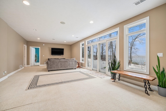 living room with visible vents, recessed lighting, baseboards, and carpet floors