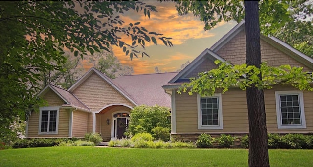 view of front of property with a yard