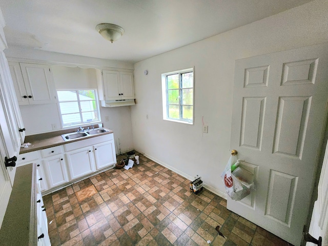 5298 Neff Ave, Detroit, MI 48224 - laundry room featuring a sink and brick patterned flooring