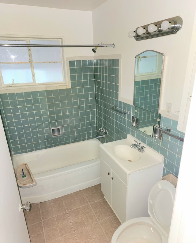 5298 Neff Ave, Detroit, MI 48224 - bathroom with tile patterned flooring, vanity, tile walls, shower / washtub combination, and healthy amount of natural light