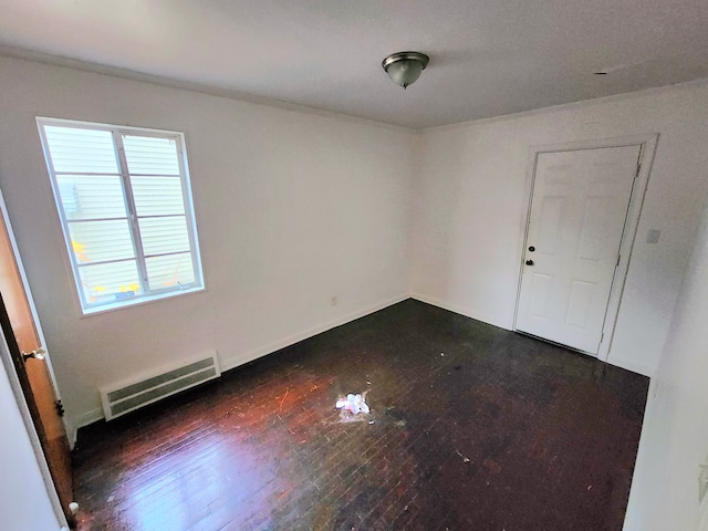 unfurnished room featuring dark hardwood / wood-style floors